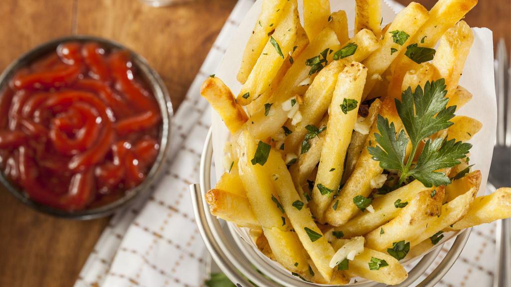 Garlic Fries · Hand cut french fries covered and smothered in garlic.