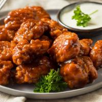 Buffalo Chicken Wings · Crispy, golden brown wings tossed in buffalo sauce.