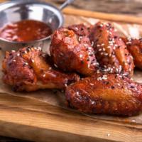 Bbq Chicken Wings · Crispy, golden brown wings tossed in bbq sauce.
