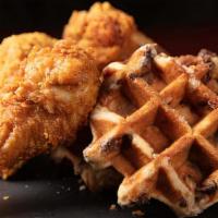 Chicken & Waffles · Crispy fried chicken and waffles with maple butter syrup.