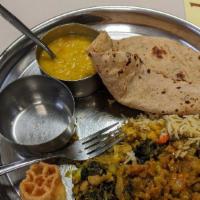 Lunch Plate · 2 vegetables, 1 pcs appetizer dal or kadhi, rice or pulao, 4 roti, and shrikhand.
