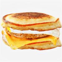 Sausage, Egg, and Cheese Pancake Sandwich · Chicken sausage, scrambled egg, and cheddar cheese between two pancakes and served with syru...