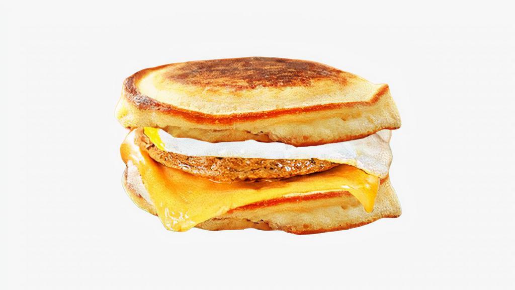 Sausage, Egg, and Cheese Pancake Sandwich · Chicken sausage, scrambled egg, and cheddar cheese between two pancakes and served with syrup on the side.