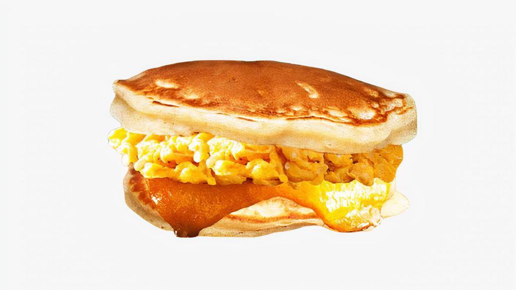 Egg & Cheese Pancake Sandwich · Scrambled eggs and cheddar cheese between two pancakes and served with syrup on the side.