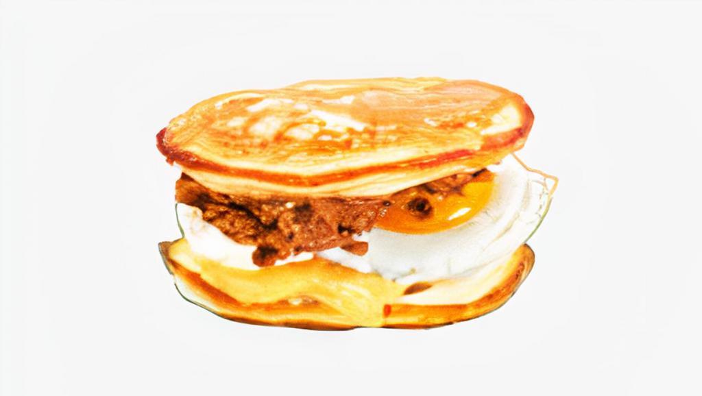 Cheesy Egg & Cheese Pancake Sandwich · Your choice of meat, scrambled egg, cheddar and Swiss cheese between two pancakes and served with syrup on the side.