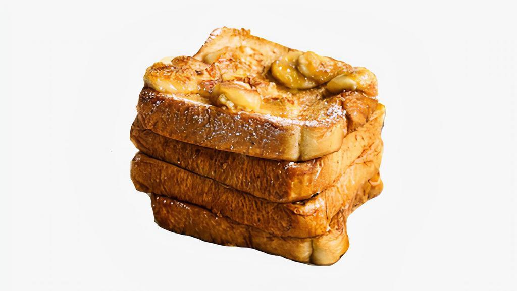 Banana French Toast · Classic French toast topped with bananas. Served with syrup on the side.
