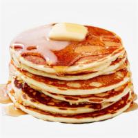 Plain Pancakes · Two large plain pancakes served with syrup.