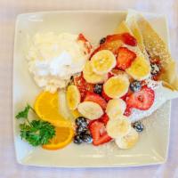 Mixed Fruit Crêpe · Strawberries, strawberry jam, bananas, and blueberries. Topped with whipped cream