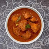 Chicken Curry · Free range chicken breast in a tomato based onion gravy with freshly ground spices.