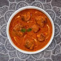 Butter Chicken · Tandoori chicken cooked in a yoghurt & creamy tomato gravy with freshly ground spices.