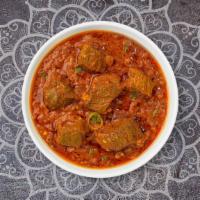 Lamb Bhunna · Lamb cooked in hot spicy curry with onions and tomatoes.