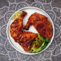 Tandoori Chicken Leg · Juicy chicken leg dipped in a yoghurt & ground spice marinate and baked in a tandoor clay oven