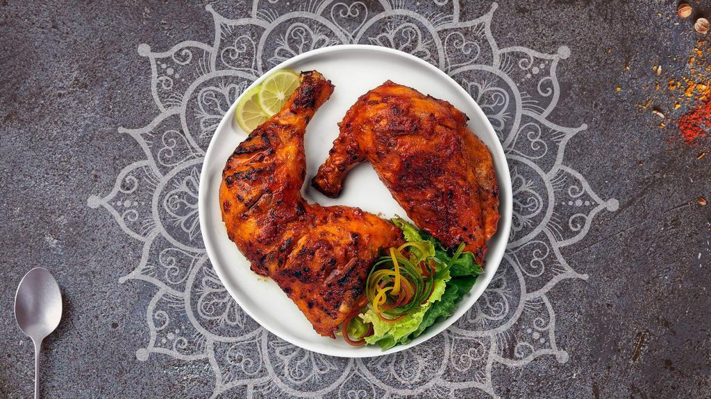 Tandoori Chicken Leg · Juicy chicken leg dipped in a yoghurt & ground spice marinate and baked in a tandoor clay oven