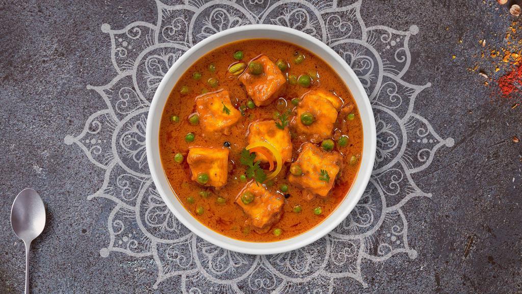 Mutter Paneer · Green peas cooked with cheese in creamy tomato sauce.