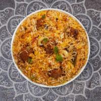 Lamb Biryani · Tender lamb cubes cooked with Indian spices and basmati rice. Served with house raita.