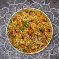 Vegetable Biryani · Spiced seasoned vegetables cooked with Indian spices and basmati rice. Served with house rai...