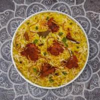 Tandoori Chicken Biryani · Tandoori chicken cubes cooked with Indian spices and basmati rice. Served with house raita.