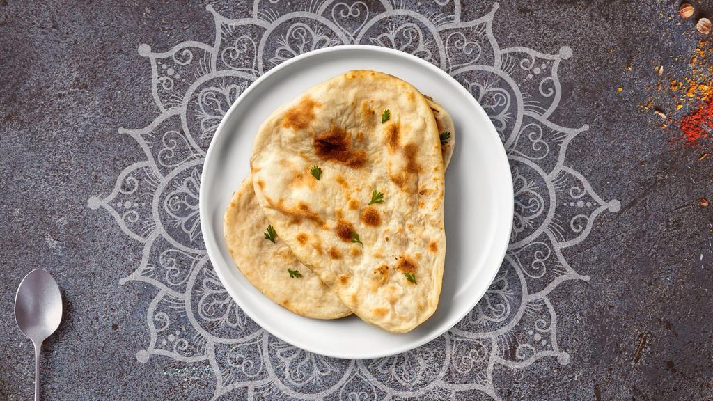 Keema Naan · Freshly baked bread in a clay oven garnished with  ground beef.