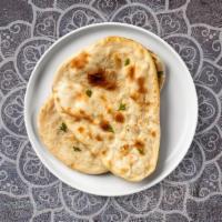 Chili Cheese Naan · Freshly baked bread in a clay oven garnished with chili and cheese