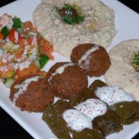 Baba Ghanoush Falafel Plate · Baba ghanoush with falafel and chopped parsley, drizzled with olive oil and topped with a sp...