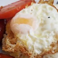Longsilog · Garlic fried rice, two eggs, longanisa.