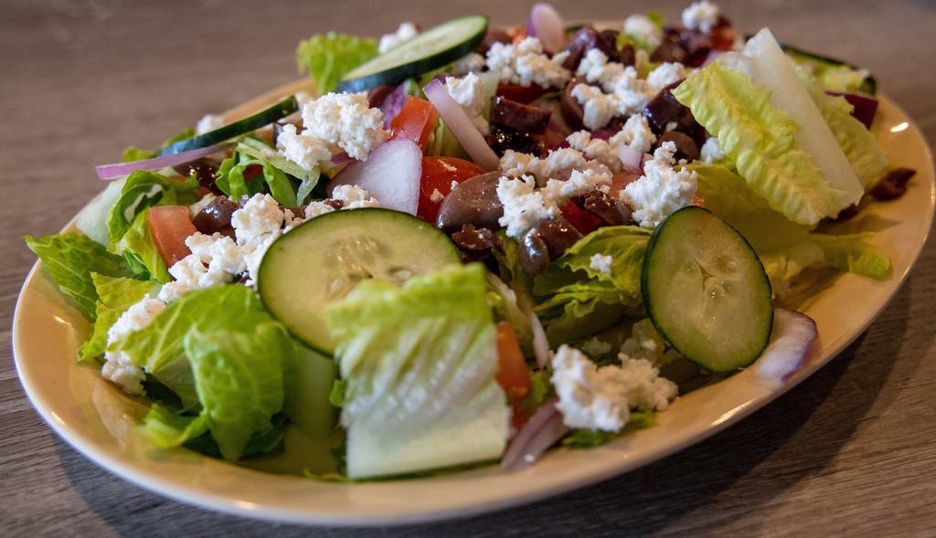 Greek Salad · Romaine lettuce, Kalamata olives, cucumbers, feta cheese, red onions, tomatoes, Italian dressing.