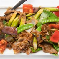 Snow Peas with BBQ Pork · Stir fried snow peas, carrots, and mushrooms in a tasty brown sauce.