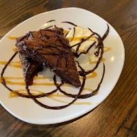 MOLTON LAVA CAKE · CHOCOLATE MOLTON LAVA CAKE WITH ICE CREAM, CARAMEL AND CHOCOLATE SAUCE