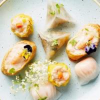 Mixed Dumplings (9 Pieces) · Steamed dumplings each of 3 pieces of vegetable, chicken and lamb.