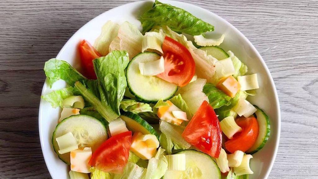 Green Salad · Vegan. Spring mixed, carrot, cucumber, cherry, and tomato with honey base dressing.