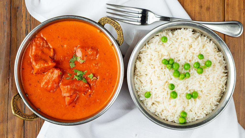 Chicken Tikka Masala · Chicken breast marinated in spices and yogurt baked in tandoor oven and cooked in a creamy onion and tomato sauce.