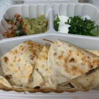 Quesadilla Grande · A large 10-inch flour tortilla filled with Monterey jack cheese. Served with sour cream, gua...