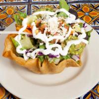 Taco Salad · Mixed greens, rice, beans, with crema, guacamole, salsa fresca and Monterey jack cheese. Ser...