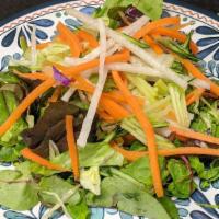 House salad · Mixed greens, lettuce, red cabbage, jicama, carrots, and cucumber topped with our house red ...