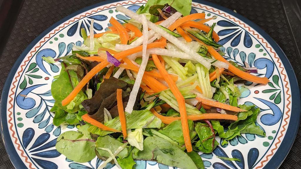 House salad · Mixed greens, lettuce, red cabbage, jicama, carrots, and cucumber topped with our house red vinaigrette dressing.