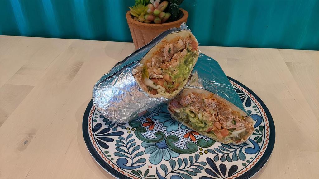 Super Burrito · Beans, rice, cheese, guacamole, sour cream, lettuce, salsa fresca, and jalapenos with your choice of grilled chicken, carnitas, chicken oaxaca, grilled steak, or prawns.