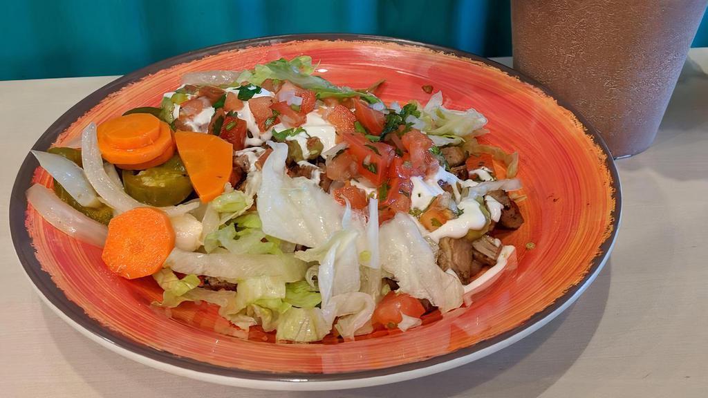 Burrito Bowl · Beans, rice, cheese, guacamole, sour cream, lettuce, pico de gallo, and jalapenos with your choice of grilled chicken, carnitas, chicken oaxaca, grilled steak, or prawns.