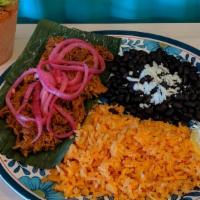 Pork Pibil · A succulent Mayan dish from Yucatán. Pork slowly braised in banana leaves, fresh fruit juice...