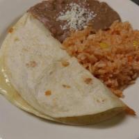 Kid's Quesadilla · A 6-inch flour tortilla with cheese. Served with rice and beans topped with Mexican cheese (...