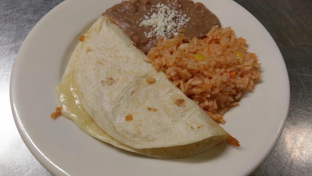 Kid's Quesadilla · A 6-inch flour tortilla with cheese. Served with rice and beans topped with Mexican cheese (queso fresco).