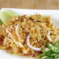 Pal Kyaw Thok - Crispy Fried Pea Salad · Vegan. Fried split peas, sliced red onion, shredded cabbage, chilli oil, fresh lime
