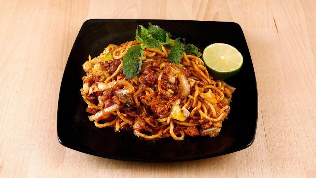 Masala Noodles · Pun thay kau swel. Contain gluten. Fried noodles with chicken, masala, cabbage, tomato.