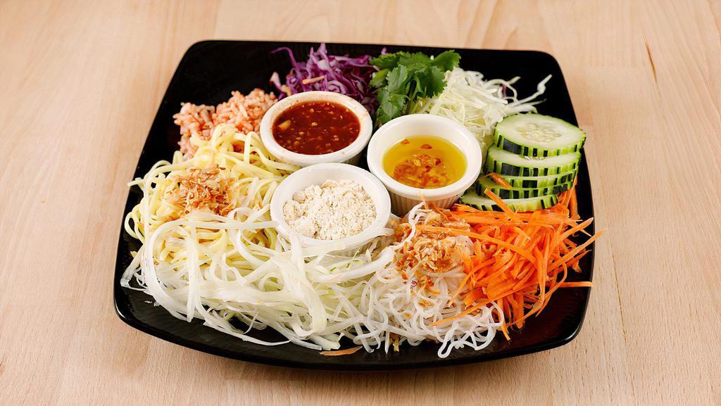 Rainbow Salad · A sown thok. Vegan, contain gluten. Assorted noodles, cabbage, red cabbage, papaya, cucumber, carrots,  with tamarind dressing. Spicy.