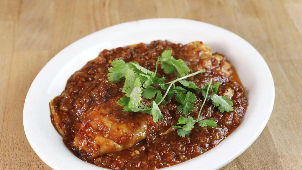 Spicy Fish · Basa fillet fish, chili flake, garlic and fried shallots.