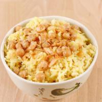 Burmese Fried Rice · Fried jasmine rice with turmeric powder, yellow peas, and onion.