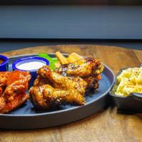 15 Wings and a side of your choice · 15 premium wings, sourced locally, fired to order, paired with your choice of 15 sauces prep...