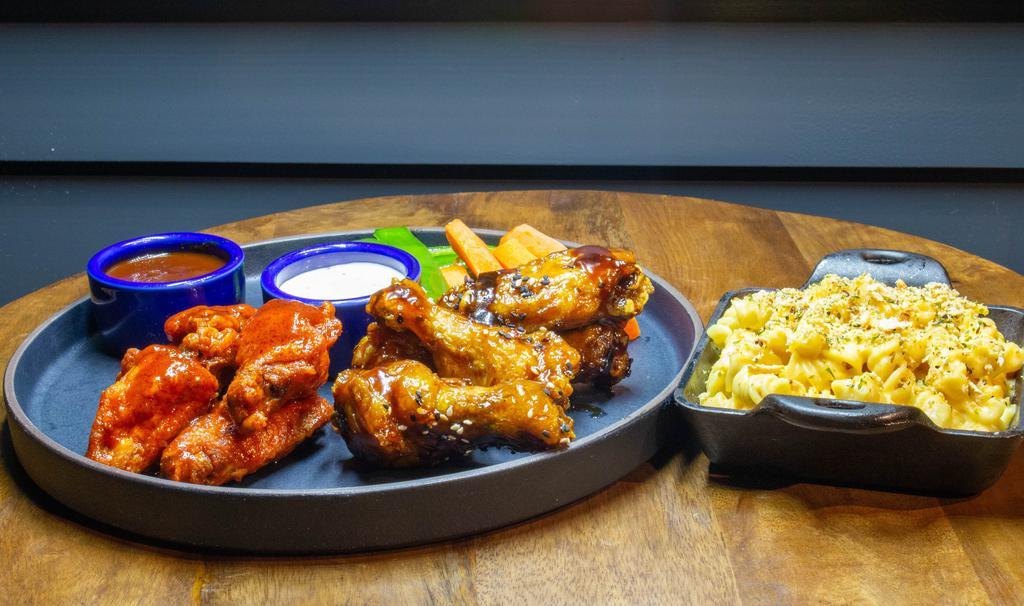 15 Wings and a side of your choice · 15 premium wings, sourced locally, fired to order, paired with your choice of 15 sauces prepared in house. including your choice of 5 different sides