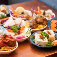 Mediterranean Meza · (For two or more) a tasting of 10 house specialties including hummos, baba ghanoush, tabuleh...