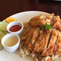 Crispy Citrus Chicken Fried Rice · Thai style fried rice with carrot and onion topped with marinated and deep fried crispy chic...