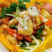 Mango curry · Home made yellow curry of prawns with coconut milk, organic red potato, yellow onion, brocco...